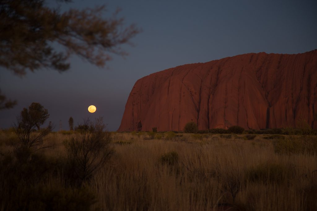 Image of moon rising over Uluru